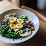 Summer Salad Nicoise plated with sliced eggs