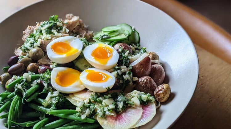 Summer Salad Nicoise plated with sliced eggs