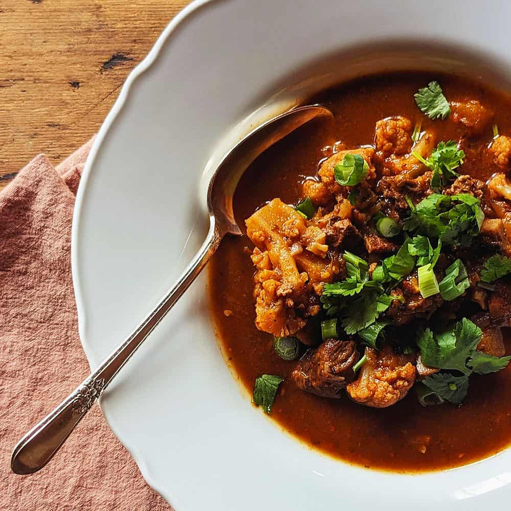Slow Cooker Beef and Chile Stew - in a bowl with spoon