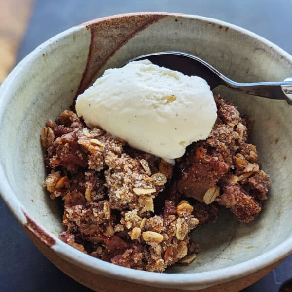 Easy Apple Crisp Crumble in a ceramic bowl with ice cream